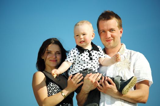 happy family on blue sky background