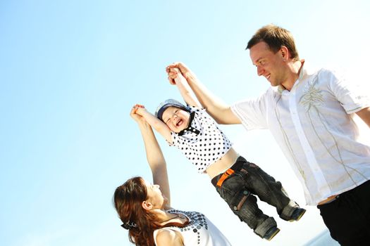 happy family on blue sky background