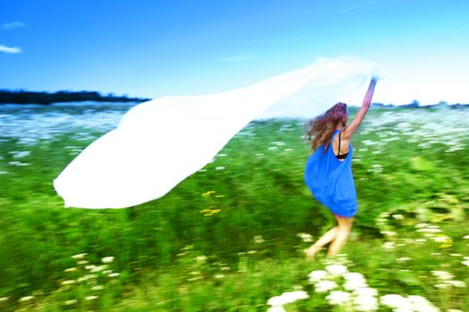  girl run by field fabric in hands fly behind like wings