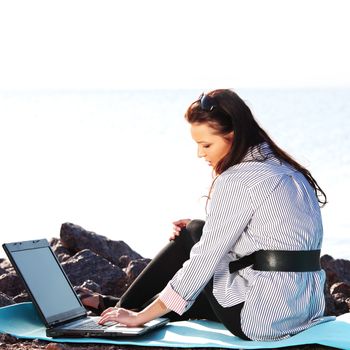 woman work on laptop sea on background