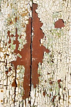 Ancient wooden walls peeling paint backdrop. Architectural details.