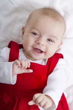 3 Months old girl smiling with no fear, waiting her teeth and hair to grow.