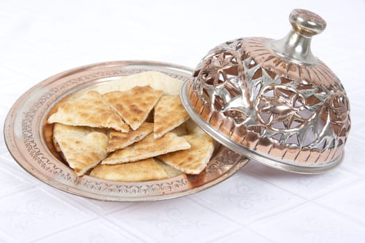 Fresh Pita Breads are served in Ottoman style copper bowl.