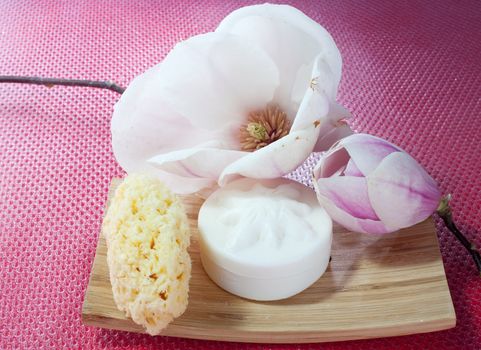 Various scented soaps and white flower