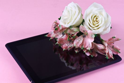 a composition and black tablet with flowers