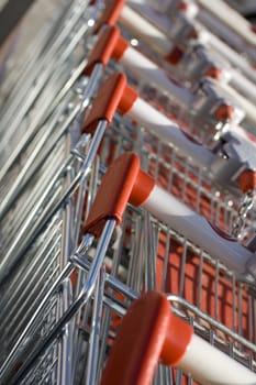 A series of shopping carts in a row