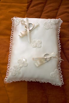 View of Wedding rings on pillow