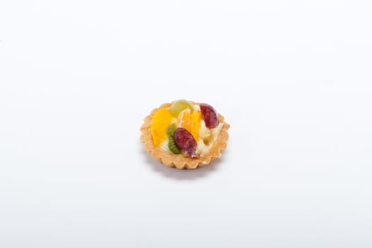 sweet cake with fruits isolated on white