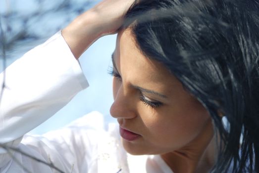 Close-up portrait of the pleasant woman outdoor in spring