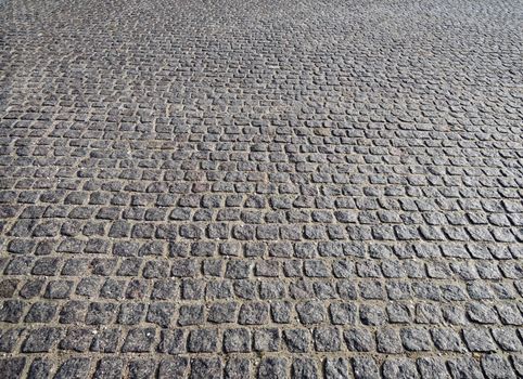 Closeup view on a cobblestone road - pattern - background