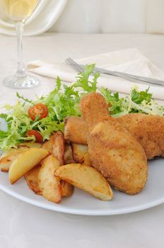 Chicken drumsticks in breadcrumbs with chips   with salad