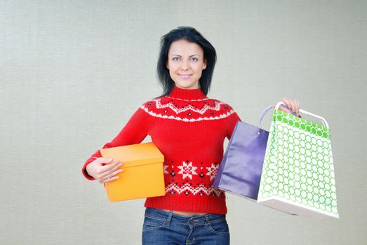 Photo of smiling lady with shopping packages and gifts