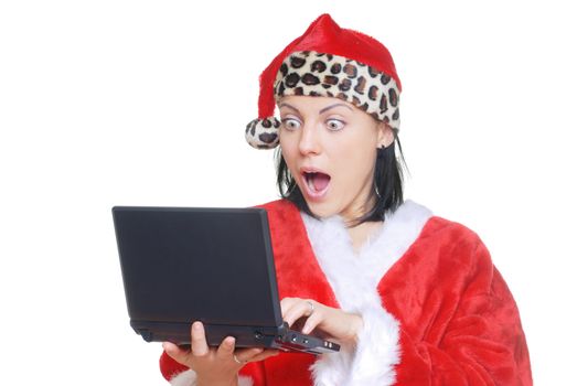 Surprised lady in Santa Claus costume reading email message