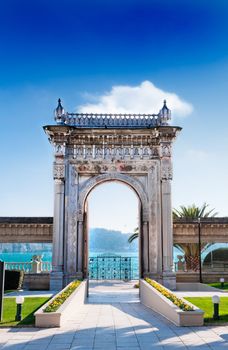 The historical sea gate of the Ciragan Palace, a royal Ottoman Empire palace by the Bosphorus in Besiktas, Istanbul, Turkey