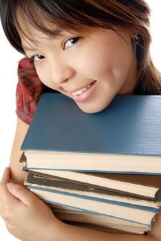 Young student with numerous books to be ready for exam