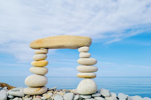 Stack of zen stones on a sky background