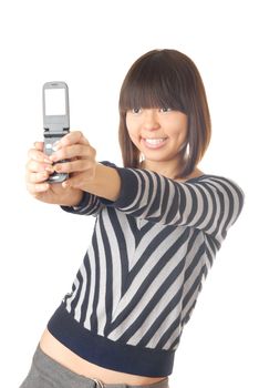 Photo of the glad teenager make a photo using cellular phone