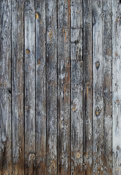 Old faded blue wooden wall, vertical boards as background