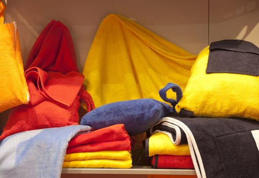 Colorful bathrobe and towels in a shop