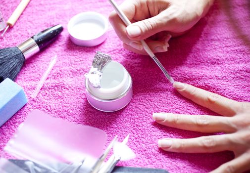 A Woman painting her nails