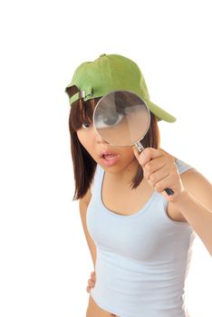 Clever girl with magnifier trying to make investigation