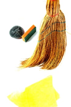 composition with straw broom and sponge