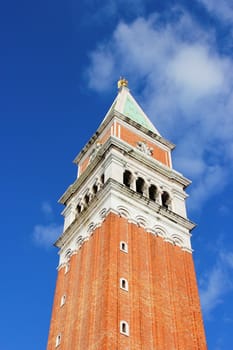 Tower in Venice. Beautifull blue sky with some clouds.