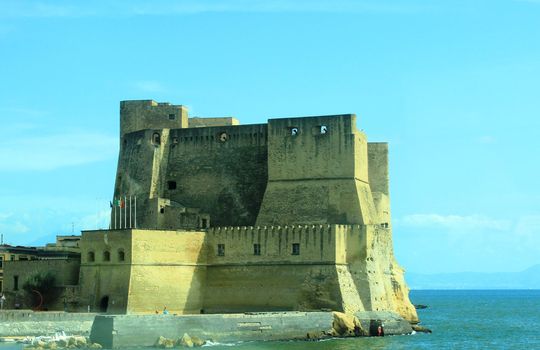 fortress in Naples on the shore sea. Blue, clear sky.