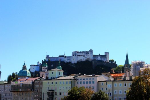 view of the castle in Salzburg. Clear blue sky.