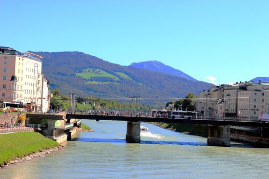 landscape of Salzburg. View to the river and mountains. Clear blue sky