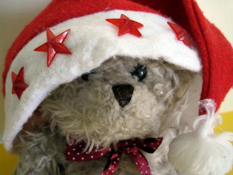 a cute bear wearing a Santa hat