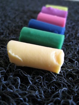 a multi color clay in a row