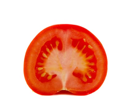 Half of cut tomatoe vegetable closeup isolated on white background. Healthy food. Nutrition.