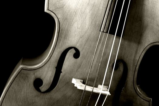 Image of a double bass or standup bass, on a black background.