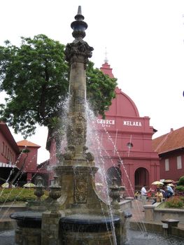 A fountain in front of the Church.