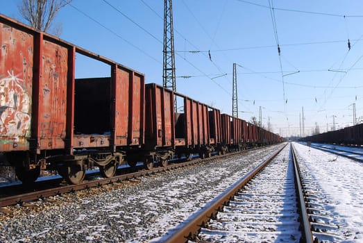 Abandoned freight wagons, railway lines in perspective