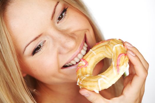 woman eating a cake on a white background