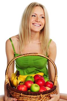 woman holds a basket of fruit on a white background