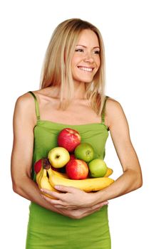 woman holds a pile of fruit on a white background