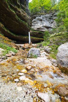 Small waterfall in Julian Alps in Slovenia - ultra wide photo