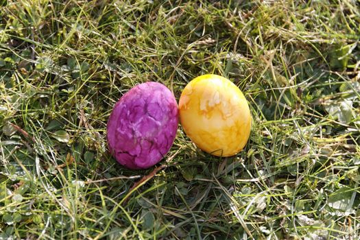 two easter eggs on the grass