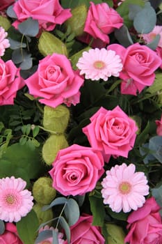 Flower arrangement with big pink roses and gerberas