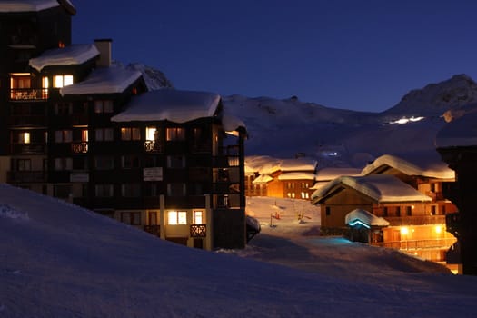 Dusk over a snowy alpine scene