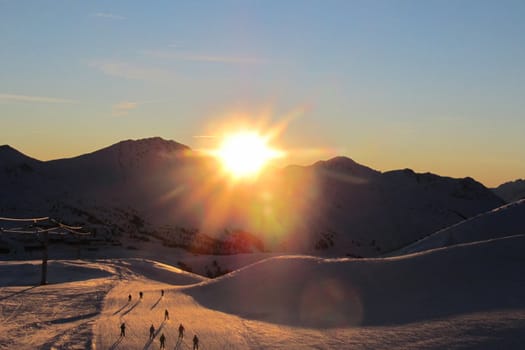 Sun setting over an alpine scene