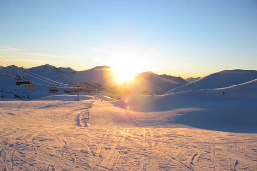 Sun setting over an alpine scene