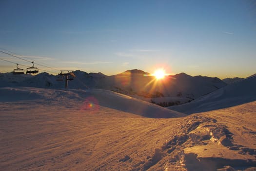 Sun setting over an alpine scene