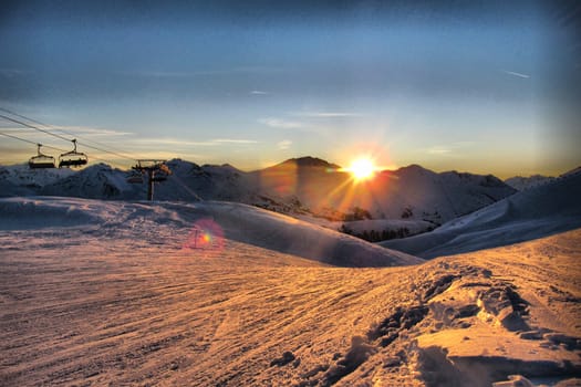 Sun setting over an alpine scene