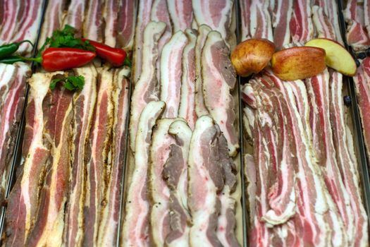 Bacon, pork belly in grocery store display