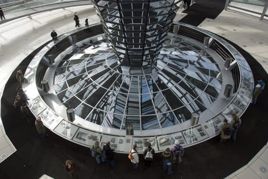 people in the Cupola on top of the Reichstag building in Berlin