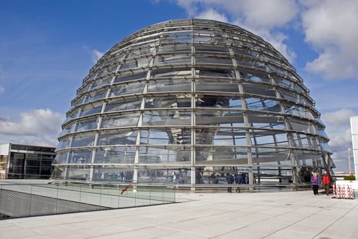 people in the Cupola on top of the Reichstag building in Berlin